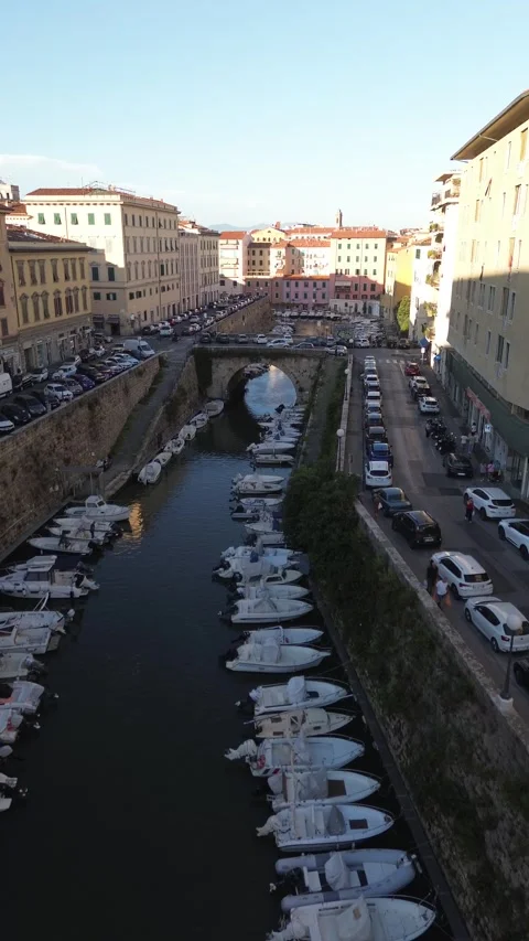 Vertical aerial view of canal, bridge and boats, Livorno Italy Stock Footage 345134286