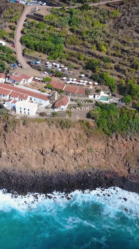 Vertical Aerial View of Cliff Top Houses Above the Ocean in Northern Tenerife Stock Footage 344851145