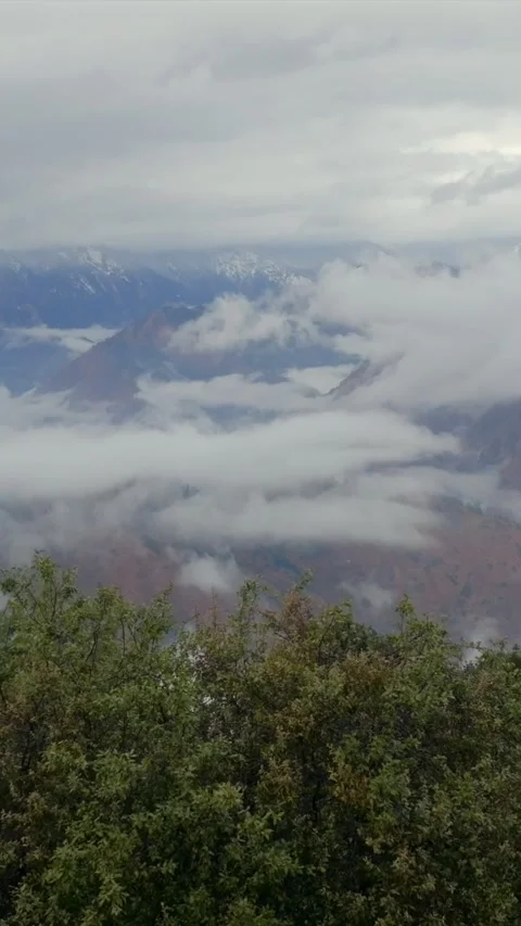 Vertical Aerial View of Cloud Covered Mountains in Kinnaur Himachal Pradesh Stock Footage 335115364