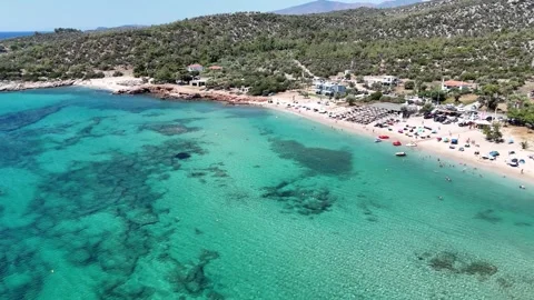 Vertical aerial view of a crowded sandy beach and turquoise water. Stock Footage 327674799