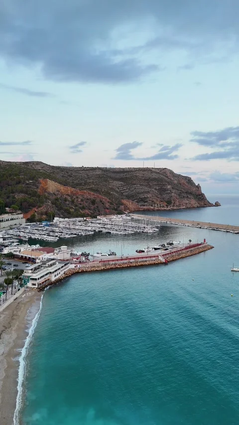 Vertical aerial view descending toward marina and beach, Javea, Spain Stock Footage 339989468
