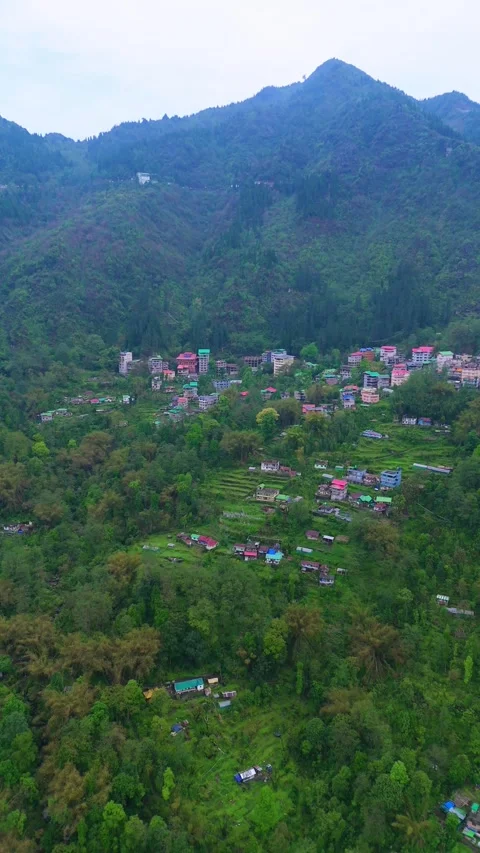 Vertical Aerial view of the dynamic city of Gangtok nestled in mountains. Stock Footage 311388991