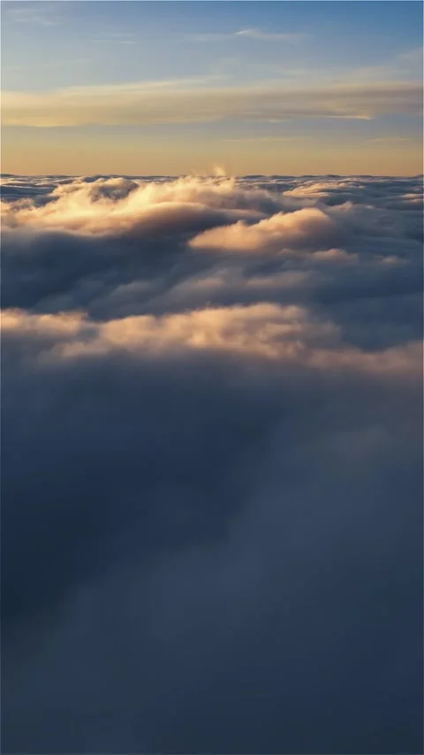Vertical aerial view flying above clouds heaven at sunrise Stock Footage 293706776