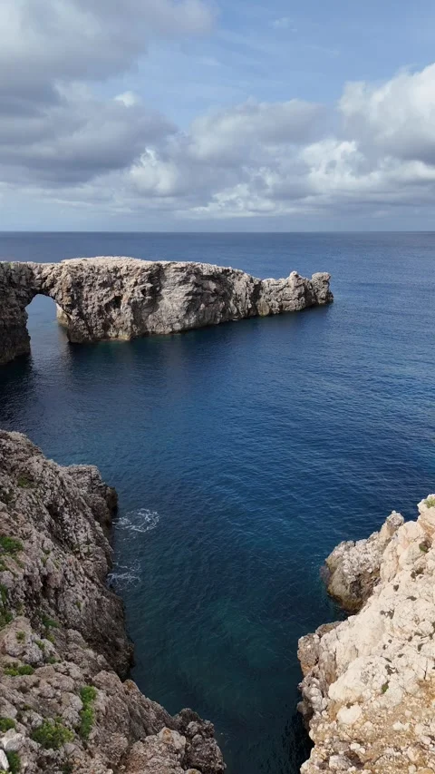 Vertical aerial view of the iconic Pont d'en Gil natural stone archway. Stock Footage 327673258