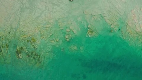 Vertical aerial view of the jagged and rocky coast of Lake Garda near Sirmione Stock-Footage 247360669