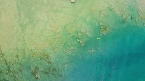 Vertical aerial view of the jagged and rocky coast of Lake Garda near Sirmione Stock Footage 247361007