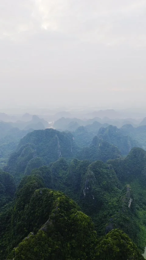 Vertical aerial view of limestone mountains in Trang An, Vietnam – 4K Stock-Footage 325040517