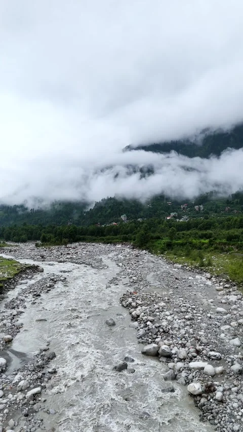 Vertical aerial view of low-hanging monsoon fog sweeping through mountains. Stock Footage 310659393