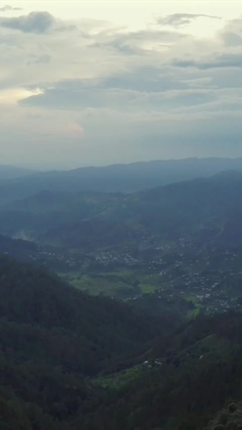 Vertical Aerial View of Lush Green Hills and Winding Mountain Roads in Almora Stock Footage 345485290