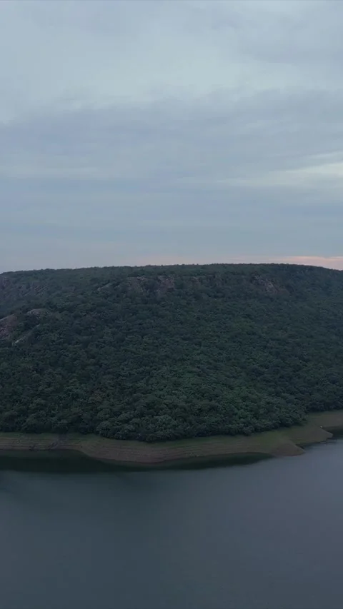 Vertical Aerial View of Lush Green Hills Forests and Water Bodies in Pratapgarh Stock Footage 345488521