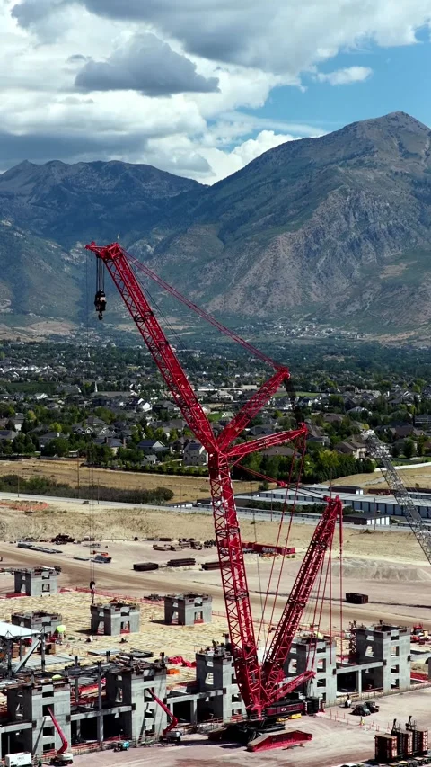 Vertical Aerial View of Massive Crane at Utah Suburb Construction Site Stock Footage 345689573