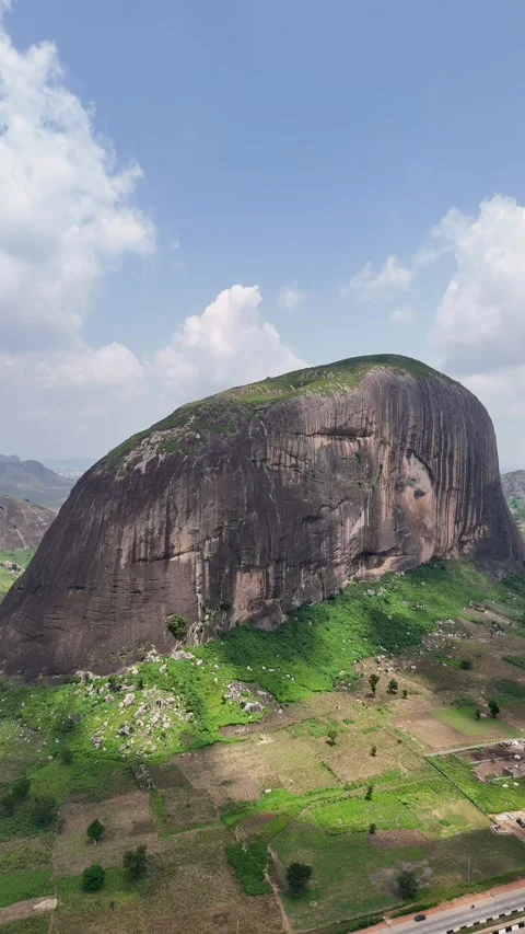 Vertical aerial view of a massive granite rock formation 스톡 동영상 345449861