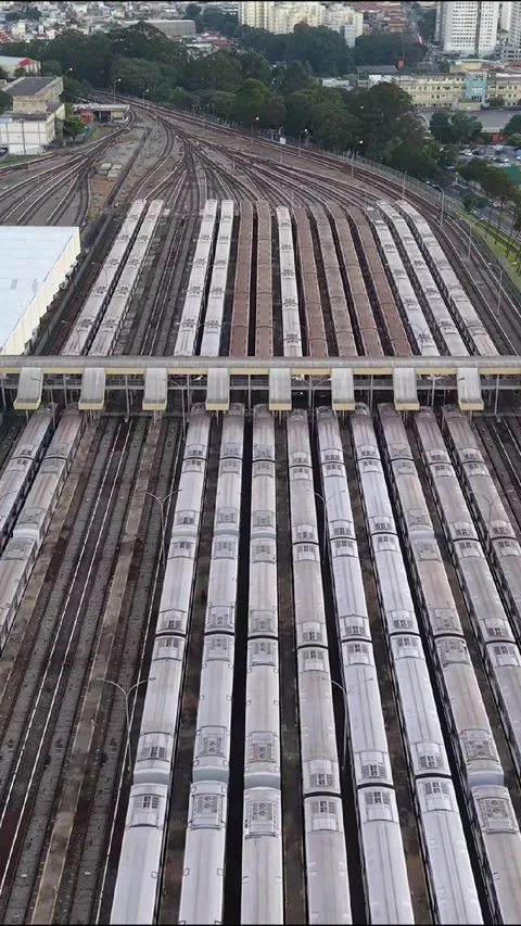 Vertical Aerial View of Metro Trains Across Large Railway Depot Stock Footage 340535904