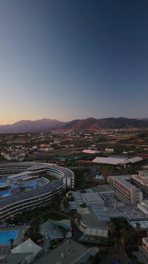 Vertical aerial view of mountains and coastal valley at sunrise in Crete Greece Stock Footage 337405006