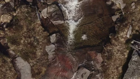Vertical aerial view of mountainside stream in the Lofoten Islands, Norway. Stock Footage 153776137