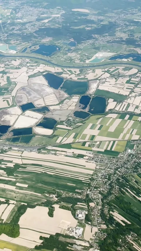 Vertical aerial view over Poland with river bends, dark lakes, patchwork Video stock 336937972