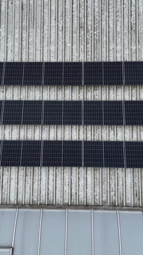 Vertical Aerial View Panning Sideways Over Industrial Solar Panel Roof Stock-Footage 330750355