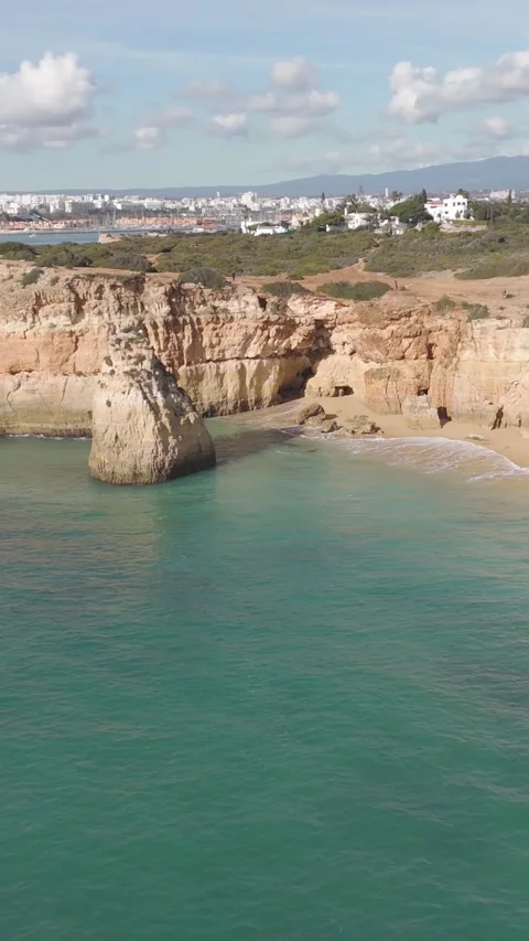 Vertical Aerial View of Praia do Torrado Beach and Turquoise Waters, Ferragudo 動画素材 347123646