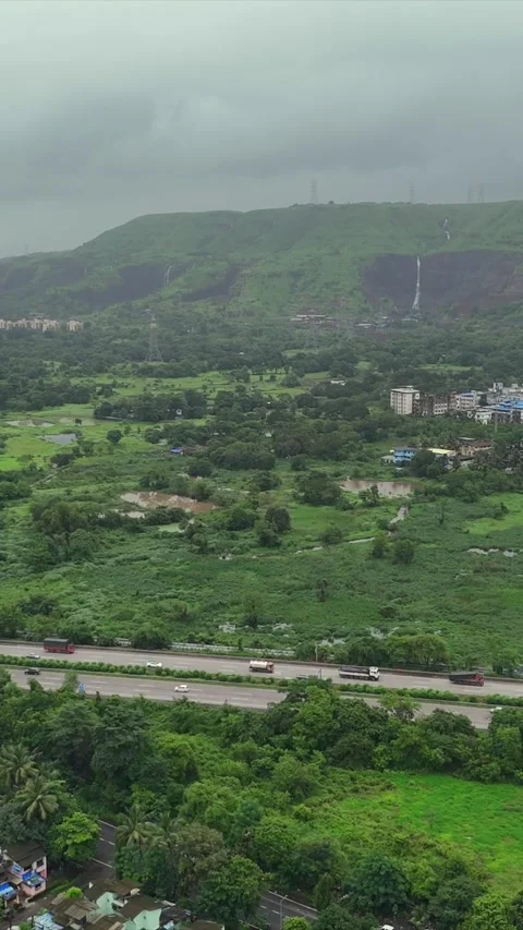 Vertical Aerial View of Pune City with Green Hills and Monsoon Landscape Stock Footage 346754372
