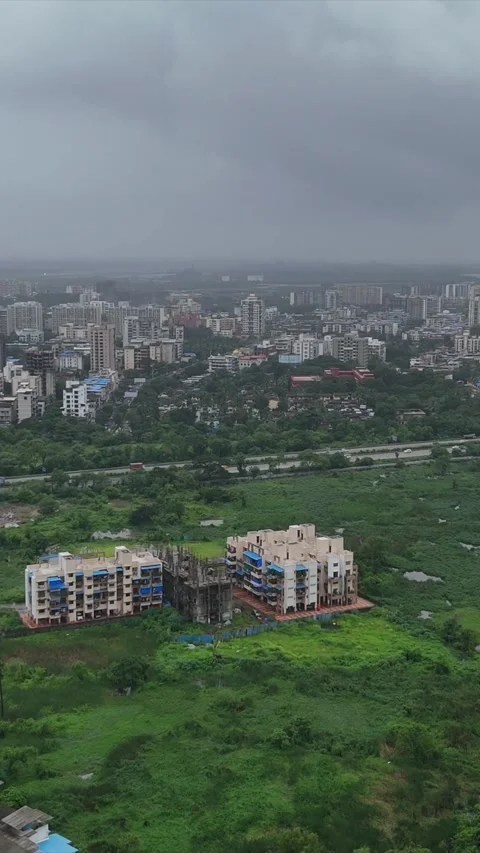 Vertical Aerial View of Pune City with Green Hills and Monsoon Landscape Stock Footage 346754430