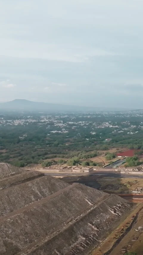 Vertical aerial view of Pyramid of the Sun, Avenue of the Dead and Teotihuacan Stock Footage 340579510
