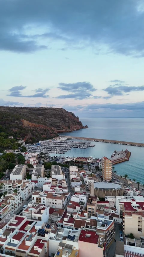 Vertical aerial view of round building and marina, Javea, Spain Stock Footage 339989465