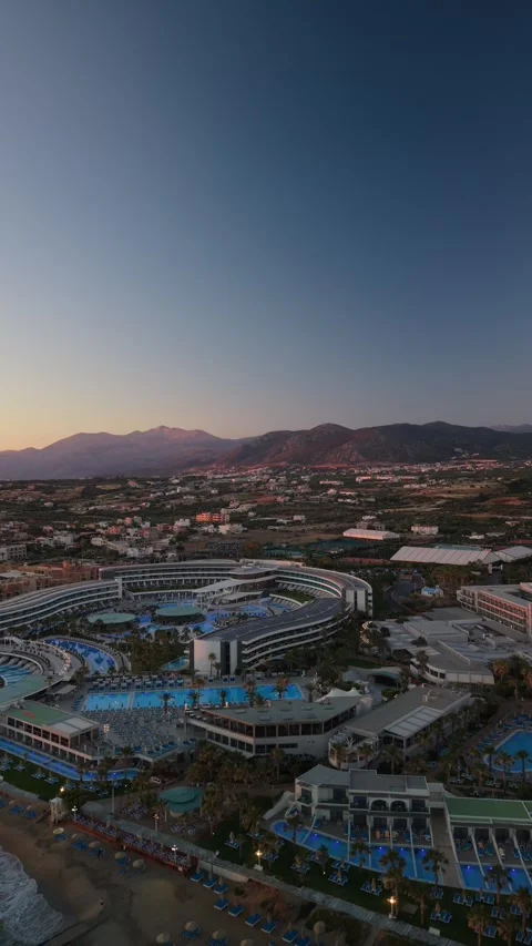 Vertical aerial view of scenic mountains and coastal valley at sunset in Crete G Stock Footage 337400816