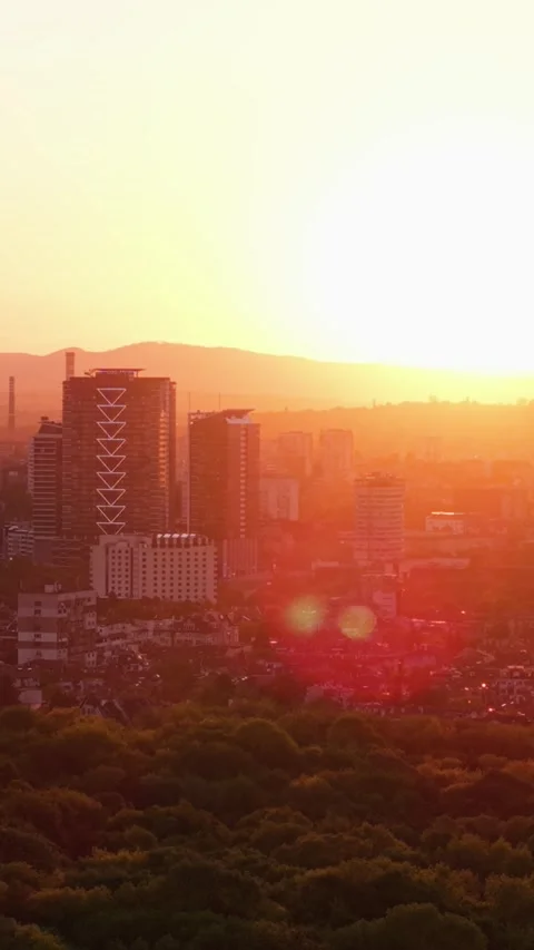 Vertical Aerial View of Sofia City at Sunset with Golden Light Stock Footage 336098179