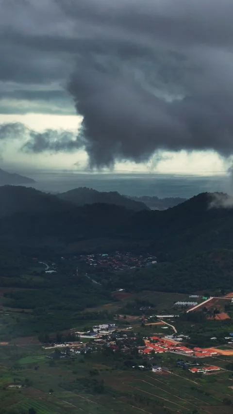 Vertical Aerial view of Tornadic storm column forms over coastal mountains Stock Footage 314931490