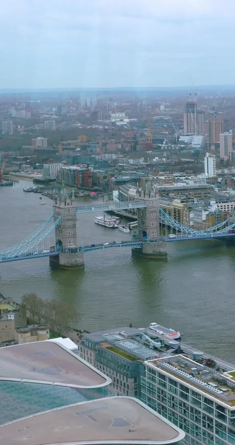 Vertical Aerial View of Tower Bridge and Thames River London Stock Footage 337906779