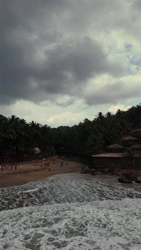 Vertical Aerial View of Tropical Beach and Rocky Coastline in Goa Stock Footage 343706802