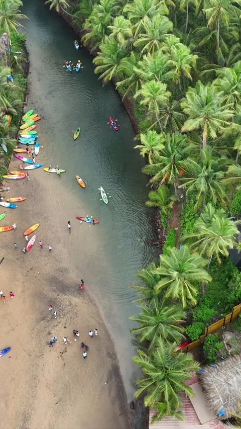 Vertical Aerial View of Tropical Beach and Rocky Coastline in Goa 库存影片 343707021