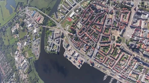 Vertical aerial view of the Warnow river, city harbor and Rostock city center Stock Footage 248889133
