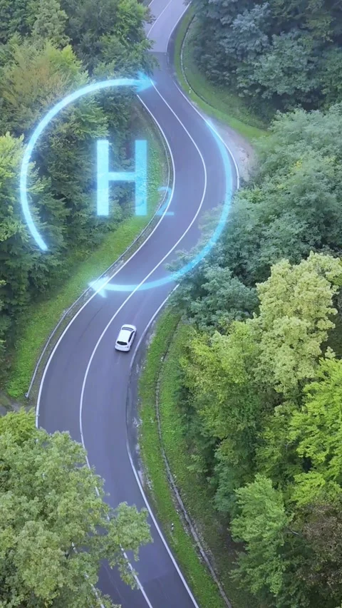 Vertical aerial view of white hydrogen car on forest road with H2 animation Stock Footage 340193643