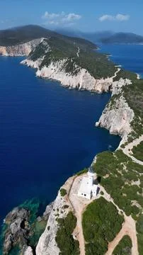 Vertical Aerial View of White Lighthouse on Dramatic Maritime Cape Fotos Stock