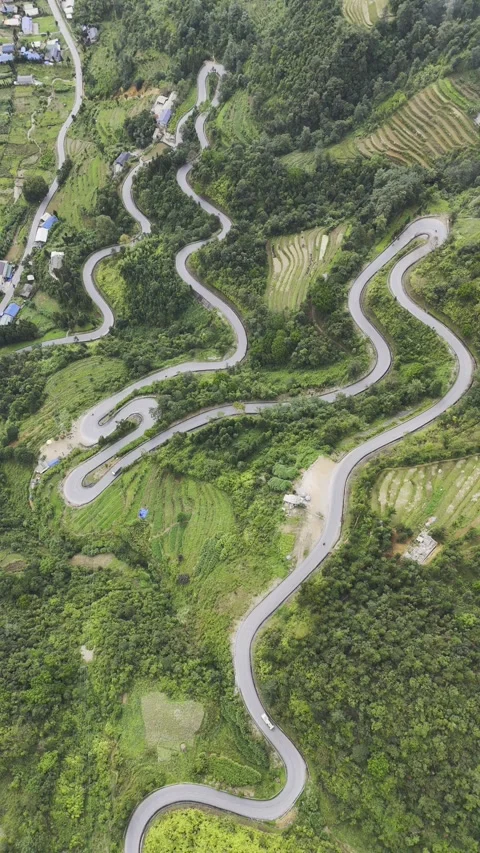 Vertical aerial view of winding mountain roads in Ha Giang, Vietnam – 4K Stock-Footage 325040508