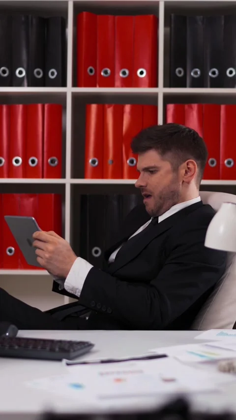 Vertical of After the work I have time for playing on tablet PC Stock Footage 305484140