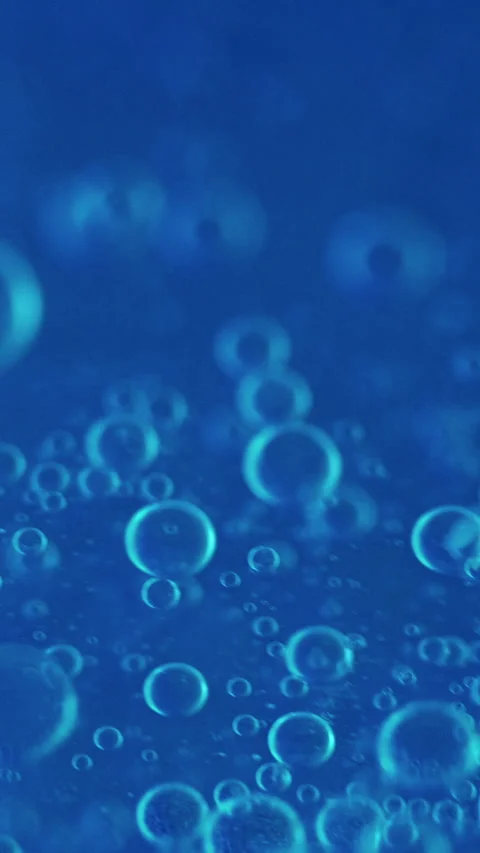 Vertical air bubbles fizzy texture blue circles Video stock 288927618