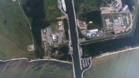 Vertical airplane view of harbor, LNG terminal and industry in Lubmin Stock Footage 248963535