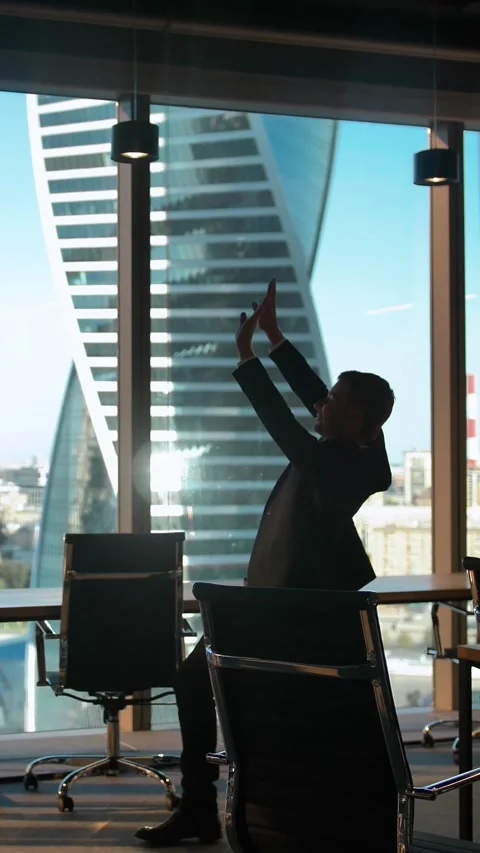 Vertical of Alone Dancing employee silhouette in modern business office with Stock Footage 277275439