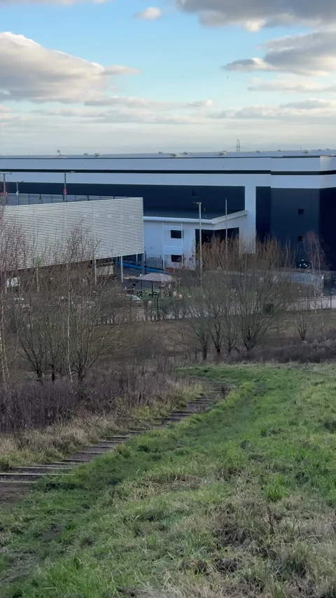 Vertical. Amazon and Aldi warehouse near Bolton pan. Stock Footage 324909246