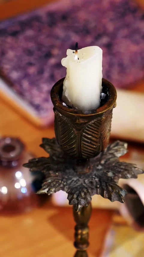Vertical. Ancient parchment, bound by time. Aged scrolls and candles. Stock Footage 305159988