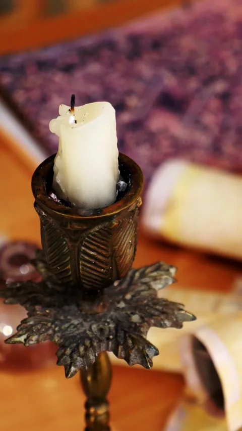 Vertical. Ancient parchment, bound by time. Aged scrolls and candles. Stock Footage 305160054