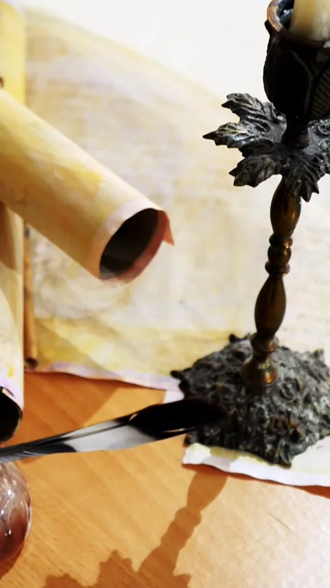 Vertical. Ancient parchment, bound by time. Aged scrolls and candles. Stock Footage 305160164