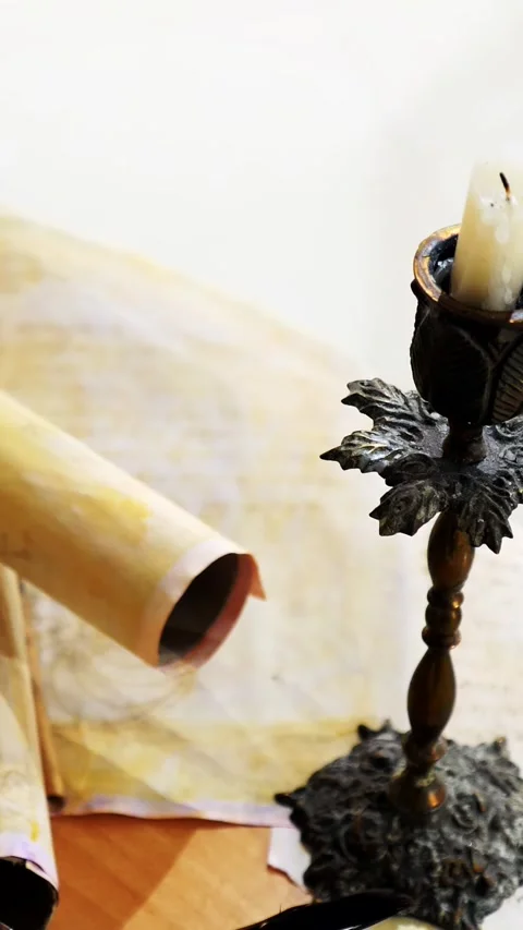 Vertical. Ancient parchment, bound by time. Aged scrolls and candles. Stock Footage 305160212