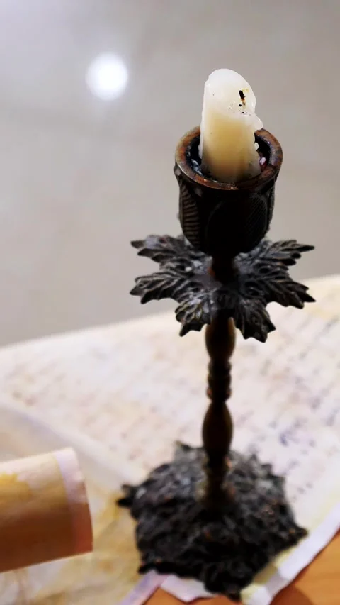 Vertical. Ancient parchment, bound by time. Aged scrolls and candles. Stock Footage 305160257