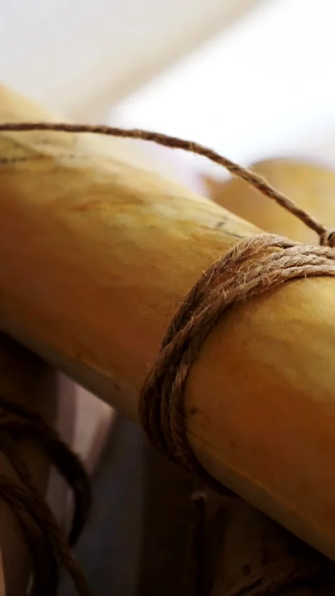 Vertical. Ancient parchment, bound by time. Aged scrolls and candles. Stock Footage 305160449