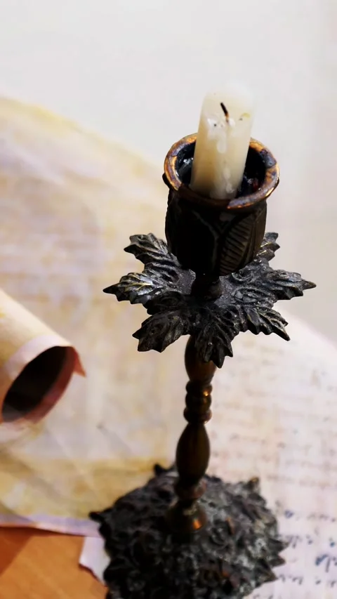 Vertical. Ancient parchment, bound by time. Aged scrolls and candles. Stock Footage 305160450