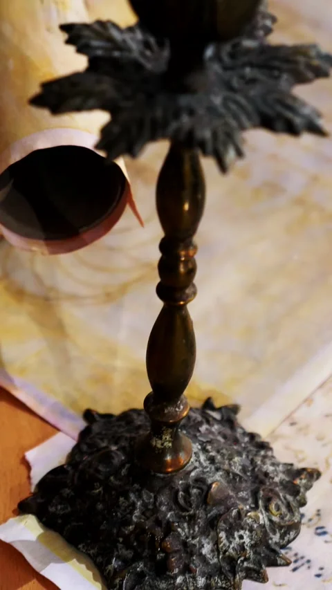 Vertical. Ancient parchment, bound by time. Aged scrolls and candles. Stock Footage 305160758
