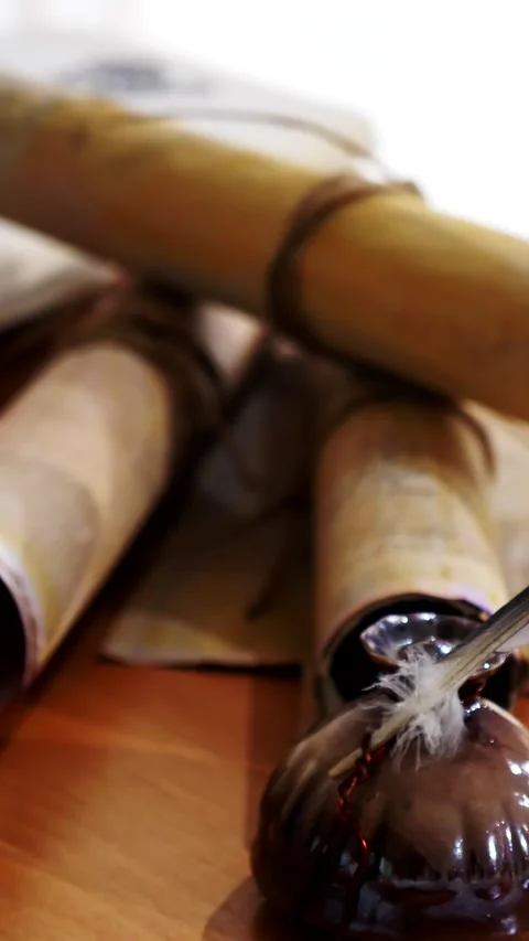 Vertical. Ancient parchment, bound by time. Aged scrolls and candles. Stock Footage 305160891